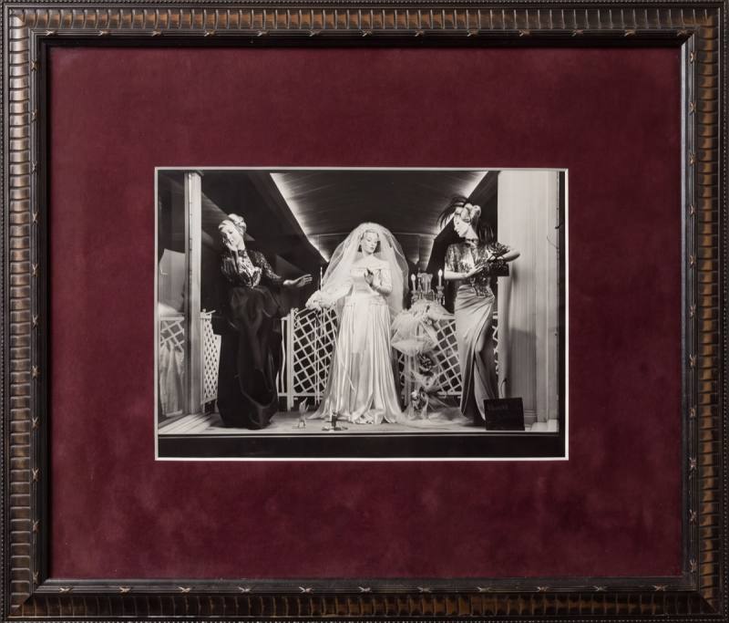 Framed photograph, the storefront window dressed with wedding gowns